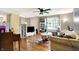 Inviting living room featuring hardwood floors, a ceiling fan, and lots of natural light at 831 Wakulla Ct, Indianapolis, IN 46217