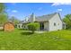 A well-manicured lawn complements the home’s architecture and a storage shed enhances outdoor living at 8451 Sunningdale Blvd, Indianapolis, IN 46234