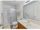 Bathroom with a shower, oak vanity, and natural light at 8451 Sunningdale Blvd, Indianapolis, IN 46234