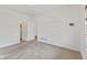 Neutral bedroom with carpet flooring, ample space, and a walk-in closet for storage at 8451 Sunningdale Blvd, Indianapolis, IN 46234