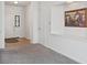 Welcoming entryway featuring light wood flooring, neutral carpet, and ample natural light at 8451 Sunningdale Blvd, Indianapolis, IN 46234