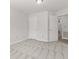 Bedroom featuring neutral carpet and multiple closets and doors at 8720 Yardley Ct # 100, Indianapolis, IN 46268