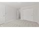 Bright bedroom featuring an additional door and double door closet at 8720 Yardley Ct # 100, Indianapolis, IN 46268