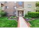 Landscaped brick path leading to front entrance with brick facade at 8720 Yardley Ct # 100, Indianapolis, IN 46268