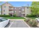 Attractive condo building with manicured lawn and inviting entrance, enhancing curb appeal at 8720 Yardley Ct # 100, Indianapolis, IN 46268