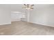 Open living space with a ceiling fan and view into the kitchen, showcasing an easy flow at 8720 Yardley Ct # 100, Indianapolis, IN 46268