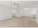 Expansive living room with light wood floors, a ceiling fan, and open layout at 8720 Yardley Ct # 100, Indianapolis, IN 46268