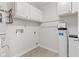 Utility room with water system, water heater, and overhead cabinets at 8720 Yardley Ct # 100, Indianapolis, IN 46268