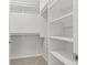 Spacious walk-in closet with built-in shelving and ample storage space at 8720 Yardley Ct # 100, Indianapolis, IN 46268