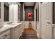 Bright bathroom with a large vanity, modern fixtures, and stylish wall decor, designed for comfort and elegance at 9312 Sullivan Pl, Zionsville, IN 46077