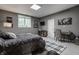 Cozy bedroom with a large bed, window for natural light, and a desk, creating a comfortable and functional space at 9312 Sullivan Pl, Zionsville, IN 46077