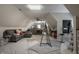 Spacious bonus room featuring vaulted ceilings, comfortable seating, and versatile workspace, perfect for hobbies at 9312 Sullivan Pl, Zionsville, IN 46077