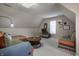 Cozy bonus room with plush seating, a round coffee table, and a window for natural light at 9312 Sullivan Pl, Zionsville, IN 46077
