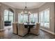 Elegant dining room with a round table and a modern chandelier fixture, and ample natural light at 9312 Sullivan Pl, Zionsville, IN 46077