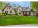 Stunning stone home with manicured lawn and lush landscaping offers incredible curb appeal at 9312 Sullivan Pl, Zionsville, IN 46077