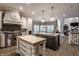Gourmet kitchen with a large island, stainless steel appliances, and custom cabinets at 9312 Sullivan Pl, Zionsville, IN 46077