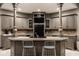Stylish kitchen bar with seating, modern cabinetry, and updated appliances, perfect for casual dining at 9312 Sullivan Pl, Zionsville, IN 46077