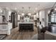 Well-lit, modern kitchen with marble countertops, stainless steel appliances, and custom cabinetry at 9312 Sullivan Pl, Zionsville, IN 46077