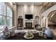 Spacious living room featuring a fireplace, large window, and stylish decor at 9312 Sullivan Pl, Zionsville, IN 46077