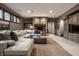 Comfortable living room with stone fireplace, large sectional sofa, and neutral decor, great for gatherings at 9312 Sullivan Pl, Zionsville, IN 46077