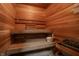 Inviting home sauna featuring wooden benches, paneling, and a heater for a relaxing and therapeutic experience at 9312 Sullivan Pl, Zionsville, IN 46077
