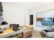 Bright home office with a wooden desk, modern art, and stylish seating at 9386 Abner St, McCordsville, IN 46055