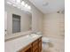 Standard bathroom with wood vanity, framed mirror and tub-shower combo with neutral color palette at 9454 W Canoe Trl, Pendleton, IN 46064