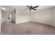 Spacious carpeted bedroom with a ceiling fan, offering a comfortable retreat within the home at 9454 W Canoe Trl, Pendleton, IN 46064