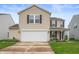 Charming two-story home features a two-car garage, well-kept lawn, and pleasant curb appeal at 9454 W Canoe Trl, Pendleton, IN 46064