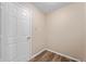 Hallway with durable vinyl flooring, offering a transition between spaces in this well-maintained home at 9454 W Canoe Trl, Pendleton, IN 46064