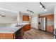 Well-lit kitchen boasts stainless steel appliances, wooden cabinets, vinyl floors, and modern countertops at 9454 W Canoe Trl, Pendleton, IN 46064