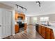 Kitchen features wooden cabinetry, modern stainless steel appliances, and sleek countertops at 9454 W Canoe Trl, Pendleton, IN 46064