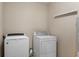Laundry area with white, front-loading washer and dryer at 9454 W Canoe Trl, Pendleton, IN 46064