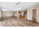 The bright living room features new flooring, a ceiling fan, and an open-concept kitchen at 9454 W Canoe Trl, Pendleton, IN 46064