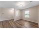 The bright living room features new flooring and ample natural light at 9454 W Canoe Trl, Pendleton, IN 46064