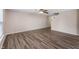The bright living room features new flooring, neutral paint, and stairs to the second level at 9454 W Canoe Trl, Pendleton, IN 46064