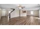 The bright living room features new flooring, a ceiling fan, and an open layout at 9454 W Canoe Trl, Pendleton, IN 46064