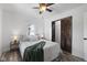 Cozy bedroom features a comfortable bed, ceiling fan, and natural light from a window at 997 Yandes St, Franklin, IN 46131