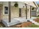 The home has a welcoming porch with wood supports, offering curb appeal to this cozy residence at 997 Yandes St, Franklin, IN 46131