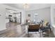 Open-concept living area with hardwood floors flows into the bright, modern kitchen at 997 Yandes St, Franklin, IN 46131