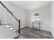 Bright living room with modern flooring and natural light from windows and staircase access at 997 Yandes St, Franklin, IN 46131