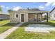 Beautiful home with a stone exterior, a covered patio, and lush green grass at 997 Yandes St, Franklin, IN 46131