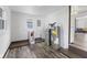 Functional utility room featuring new flooring, water filtration, and connections for appliances at 997 Yandes St, Franklin, IN 46131