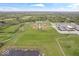 An aerial view of community baseball and soccer fields, with a school and ample parking nearby at 1013 Domino Dr, Carmel, IN 46032