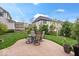 Landscaped backyard includes a patio with table and chairs for outdoor dining and relaxation at 1013 Domino Dr, Carmel, IN 46032