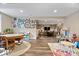 Finished basement with vinyl floors, multiple play areas and access to stairs at 1013 Domino Dr, Carmel, IN 46032