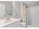 Updated bathroom features a vanity with solid surface countertop, updated fixtures, and walk-in shower at 1013 Domino Dr, Carmel, IN 46032