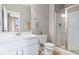 Stylish bathroom boasts a sleek vanity, updated commode, and glass enclosed walk-in shower at 1013 Domino Dr, Carmel, IN 46032