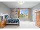 Cozy bedroom featuring neutral walls, natural light, and a twin bed with patterned bedding at 1013 Domino Dr, Carmel, IN 46032
