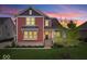 Charming two-story home featuring a well-manicured lawn and tasteful landscaping at 1013 Domino Dr, Carmel, IN 46032